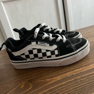 Black and white checkered vans.